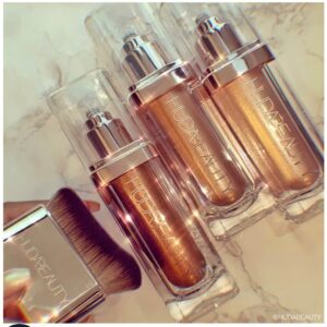 Huda Beauty N.Y.M.P.H. All Over Body Highlighter ? Liquid Illuminator for Face, Body & Legs ? Water-Based, Long-Lasting Glow ? 35 ml - Image 4